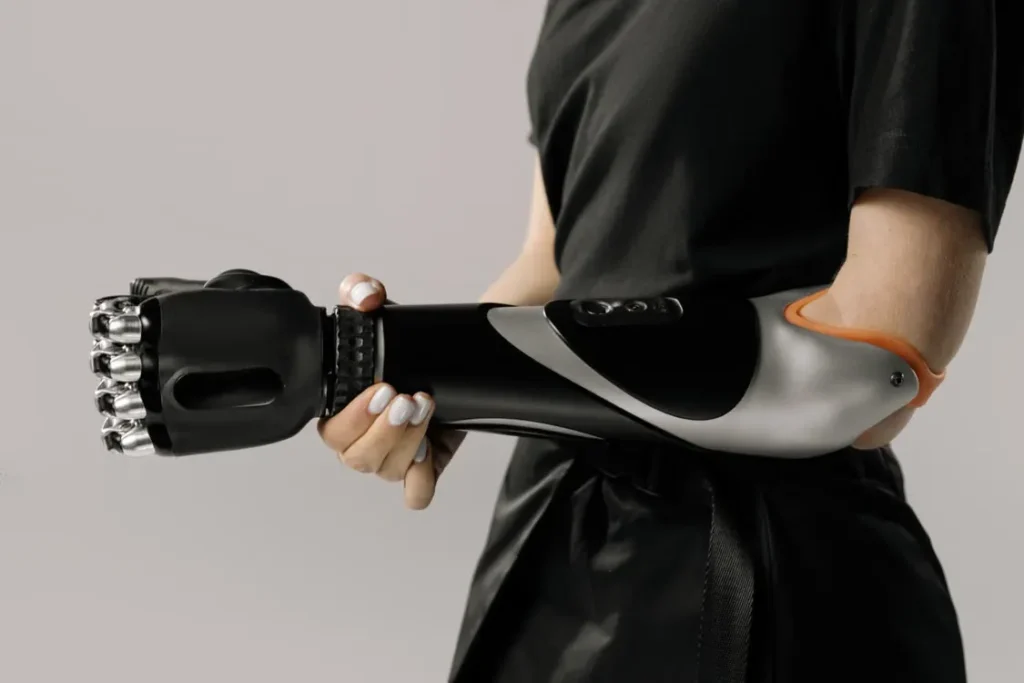 Person holding advanced prosthetic robotic arm