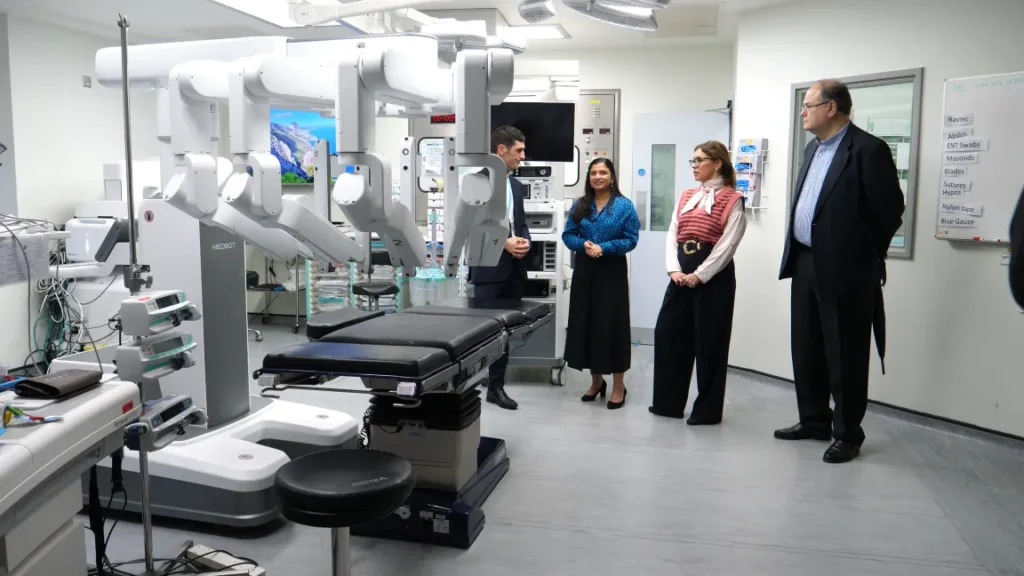 Hospital staff viewing surgical robot system