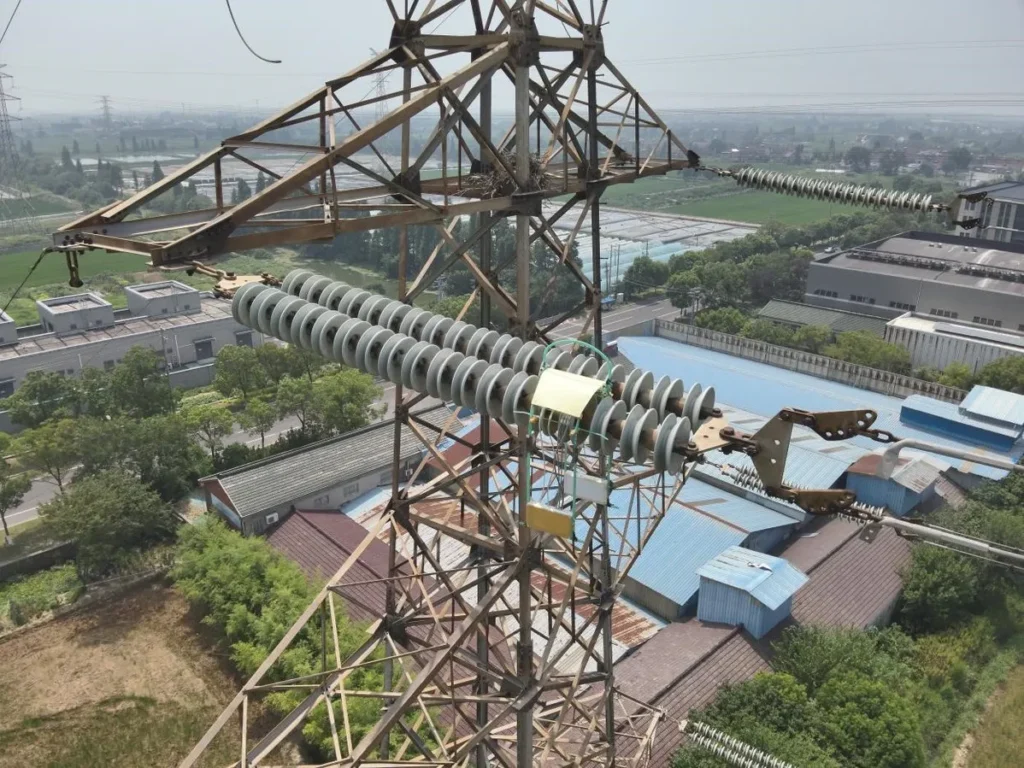 Robot inspecting power transmission tower