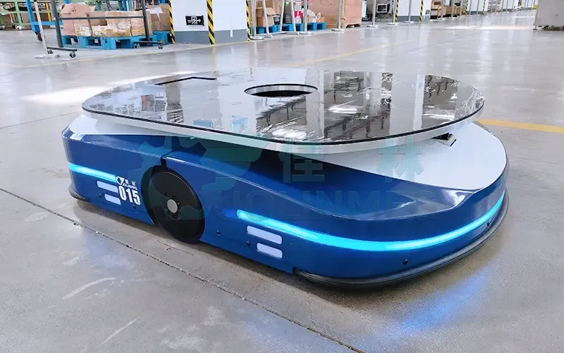 Blue autonomous mobile robot on a factory floor
