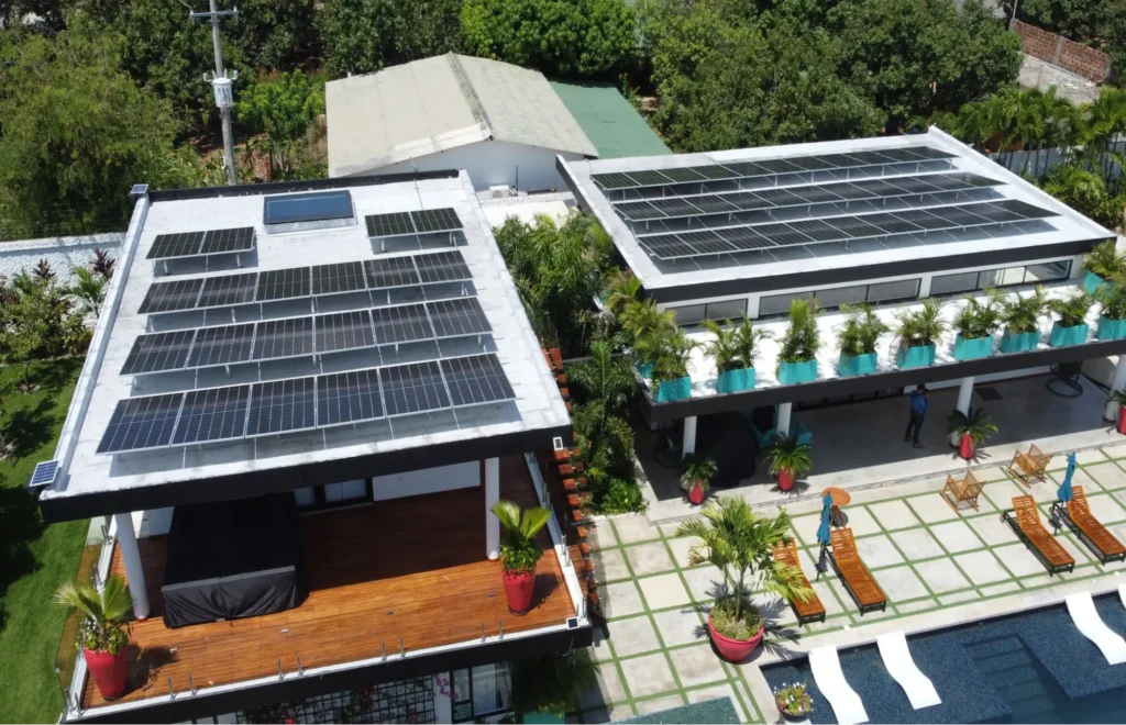 Rooftop solar panels installed across a flat commercial building roof
