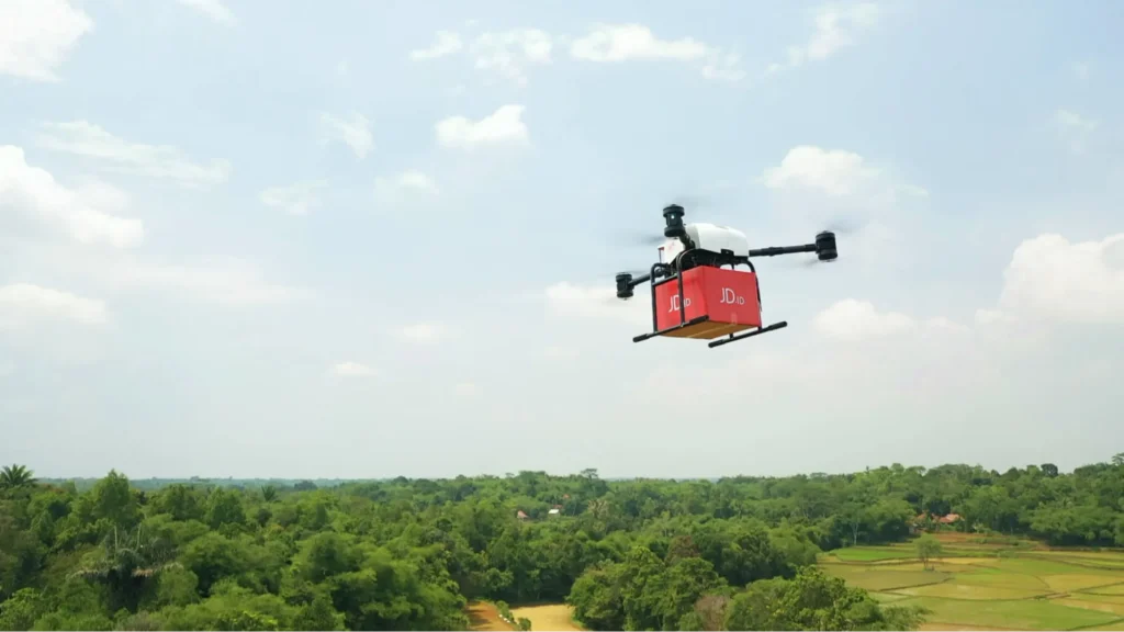 JD delivery drone flying over rural area