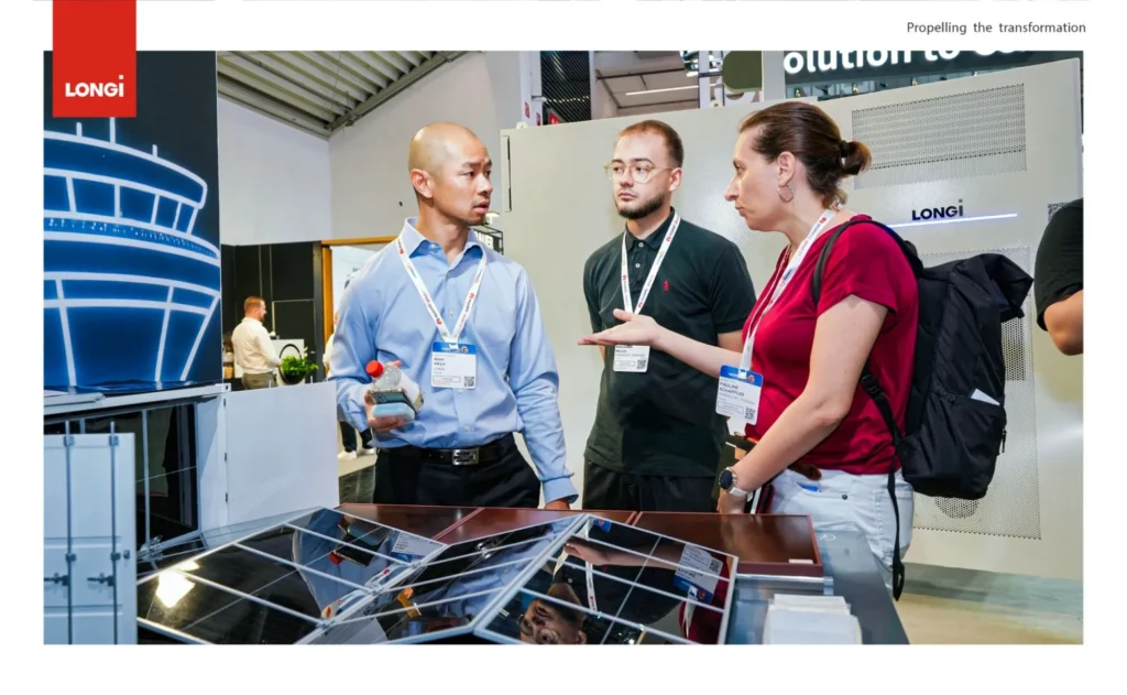 LONGi staff showing solar panels