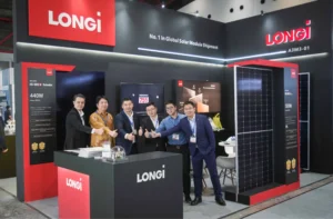LONGi staff showing solar panels