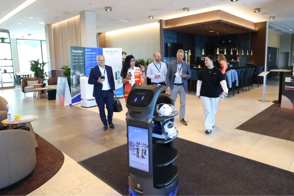 Pudu delivery robot assisting hotel guests