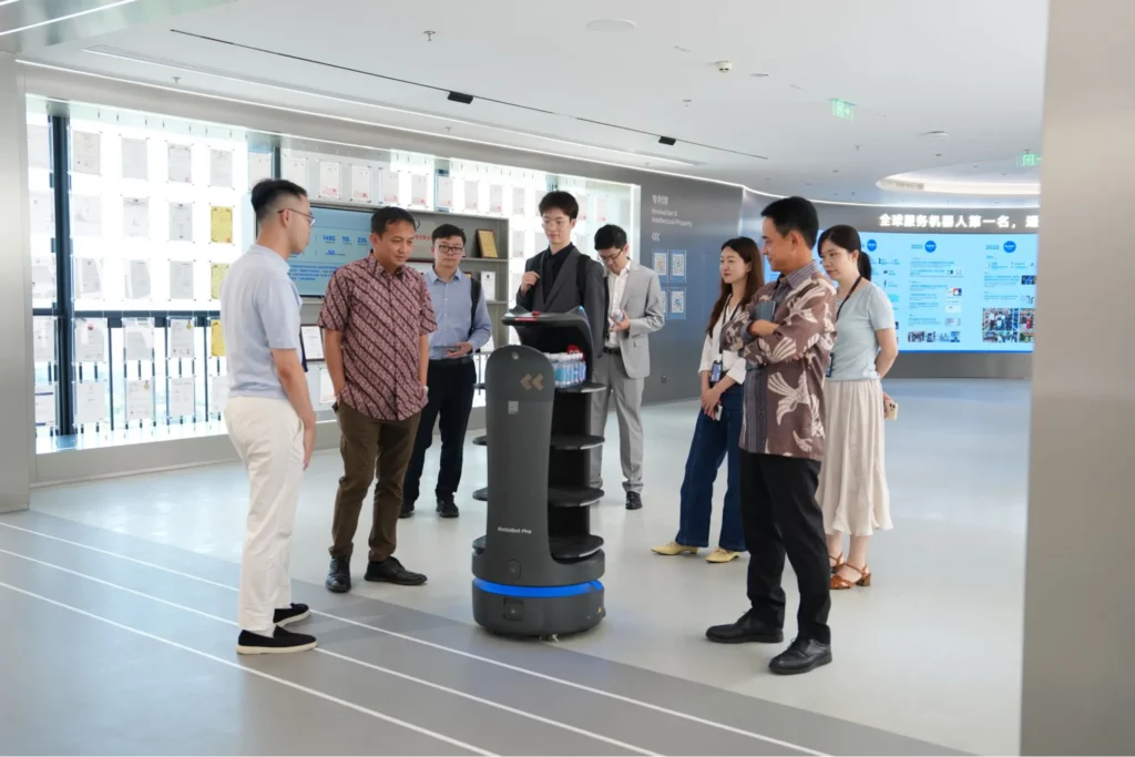 Pudu service robot demo with visitors