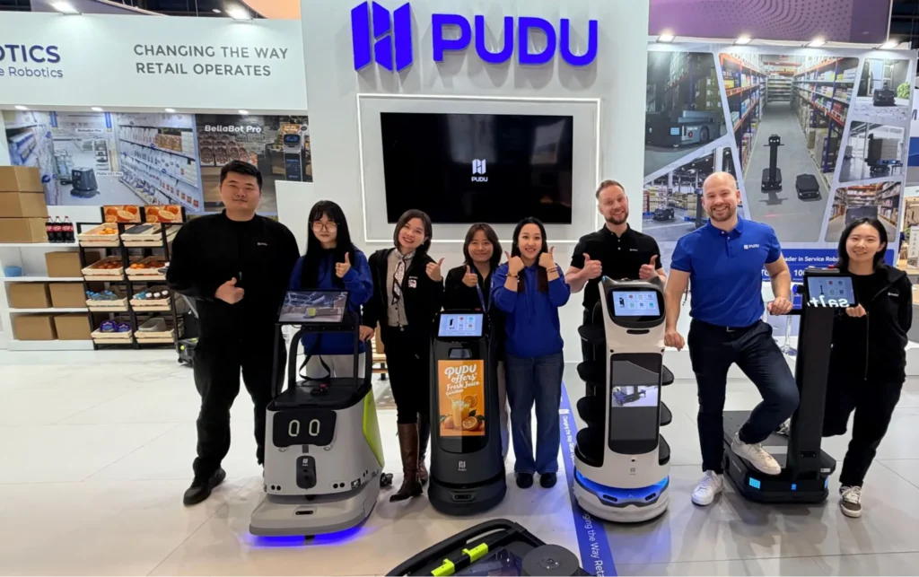 Pudu Robotics team at trade booth