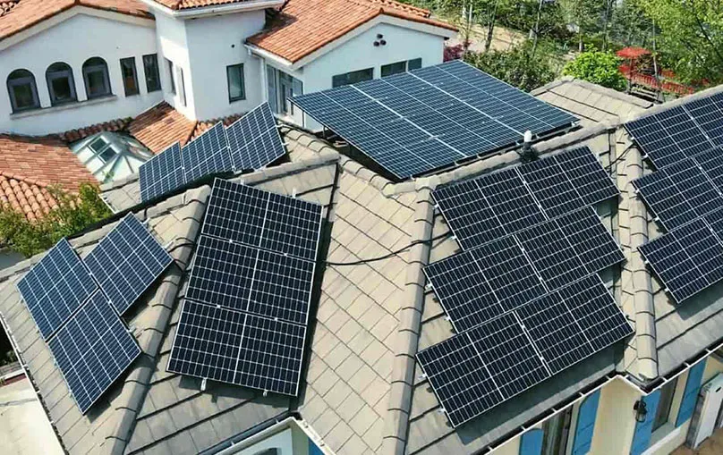 Rooftop solar panels installed on a tiled residential home
