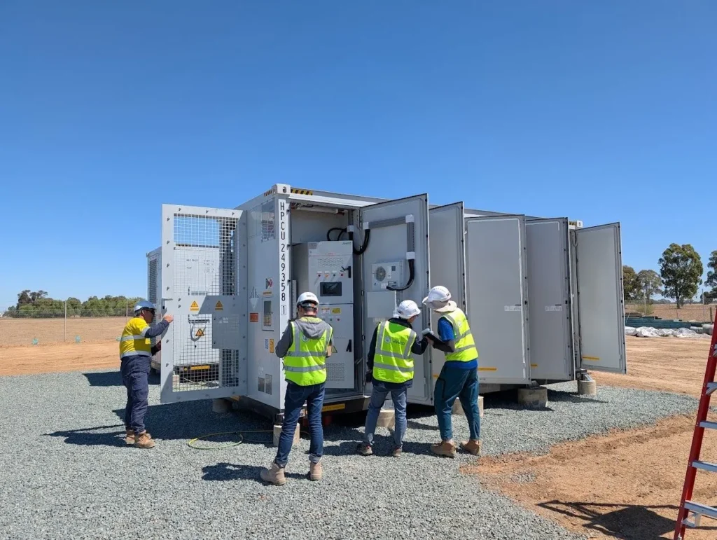 Workers inspecting solar equipment