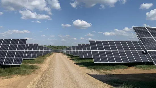 Solar panels along a farm pathway