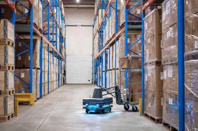 AMR carrying pallets through a warehouse aisle