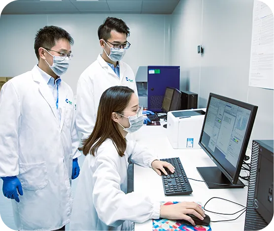 Scientists analyzing biotech research data on computer