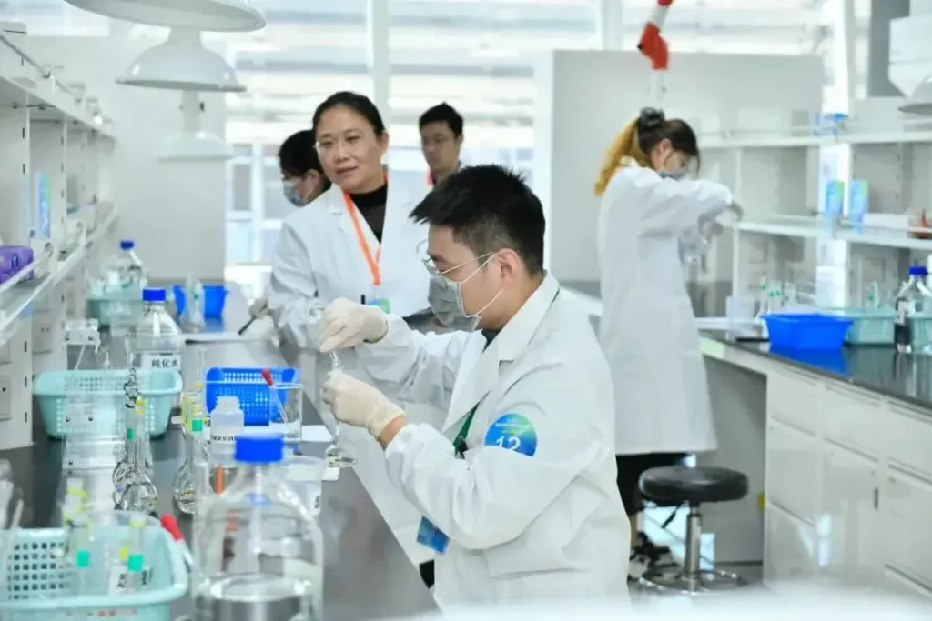 Researchers conducting experiments in a biotech lab