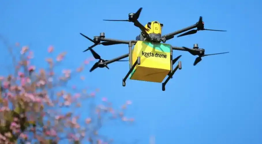 Keeta delivery drone carrying a box in flight