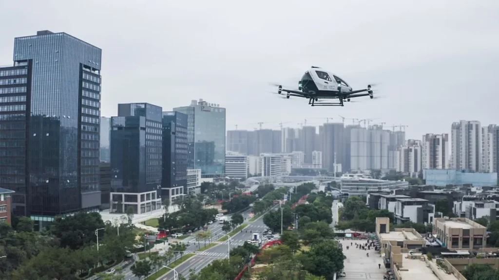 Electric air taxi flying above a modern Chinese city