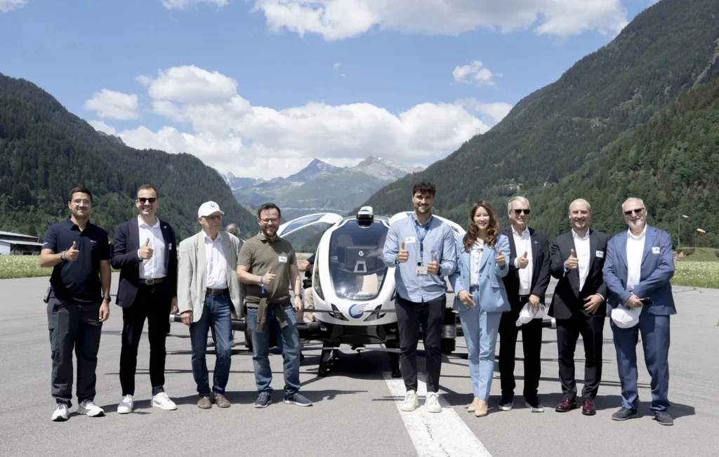eVTOL aircraft displayed with team at mountain test site