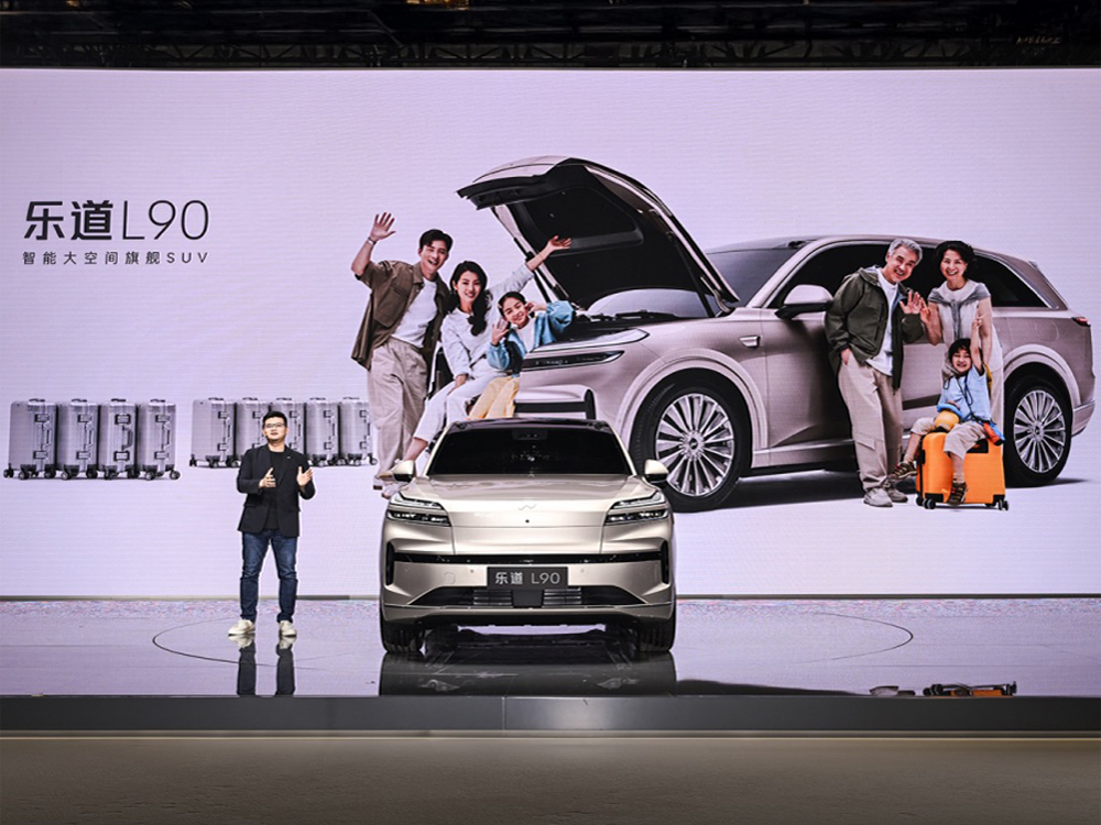 ONVO L90 presentation at Auto Shanghai 2025, showing its family-oriented positioning.