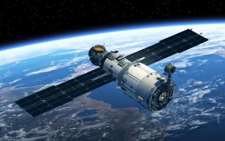 Communications satellite orbiting above Earth