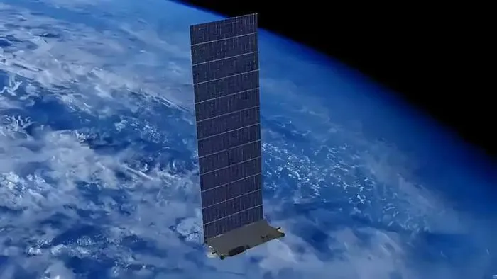 Satellite with solar panels deployed above Earth