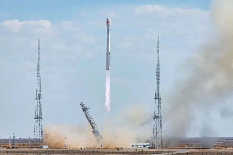 Chinese rocket lifting off with satellites