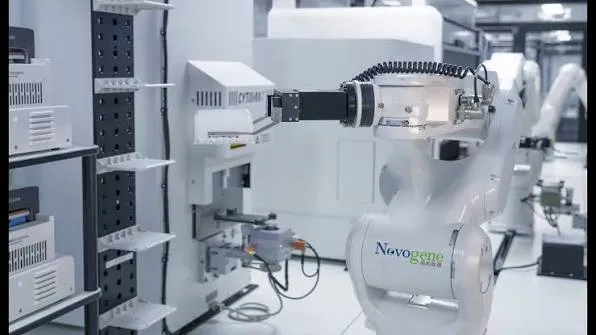Novogene robotic arm operating automated lab equipment