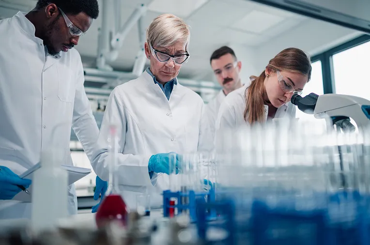 Scientists conducting laboratory research for oncology drug development