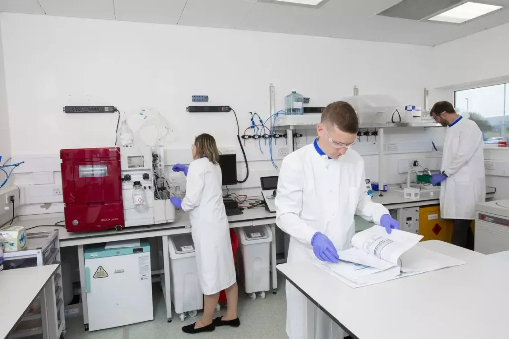 Scientists working in pharmaceutical laboratory